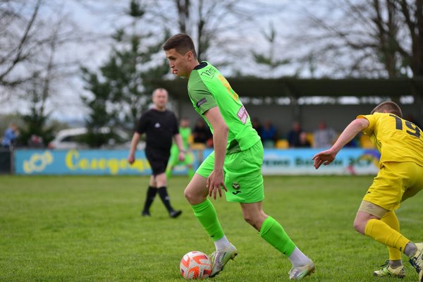 What are the optimal strategies for managing a football player's workload during the season?